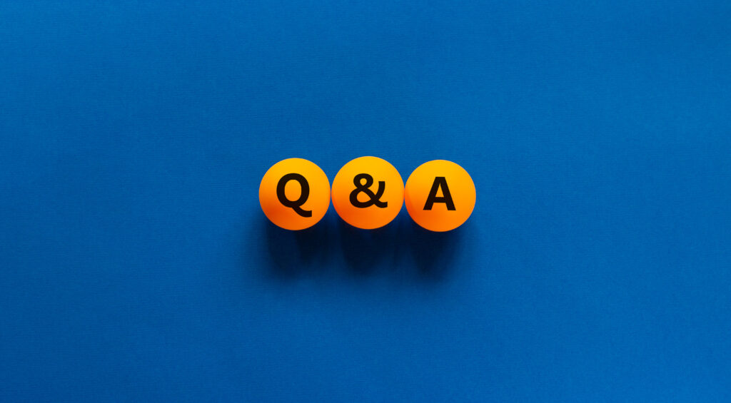 Q and A, questions and answers symbol. Concept words 'Q and A, questions and answers' on orange table tennis balls on a beautiful blue background. Business, questions and answers concept. Copy space.